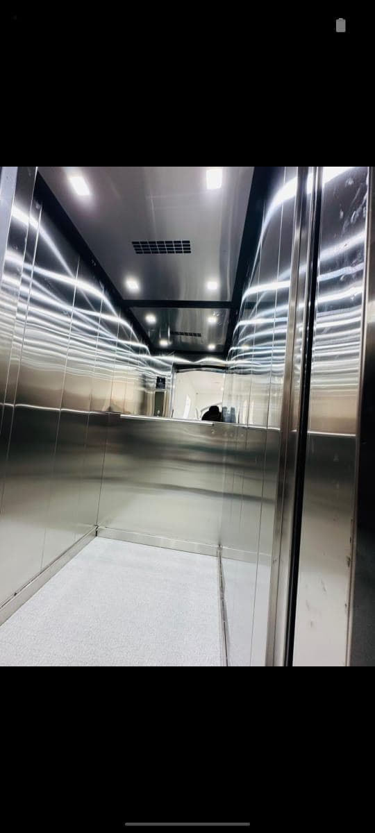 Clean stainless steel elevator cabin interior